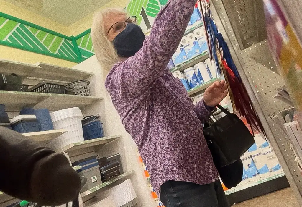 White blonde lady looking at products