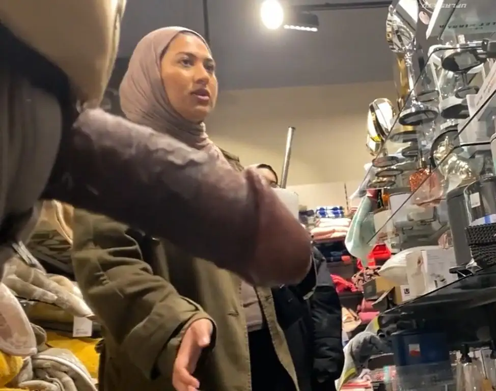Hijab in the store looking at products
