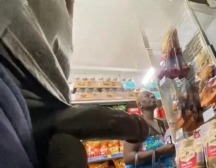 Black dick in front of mature black woman in store