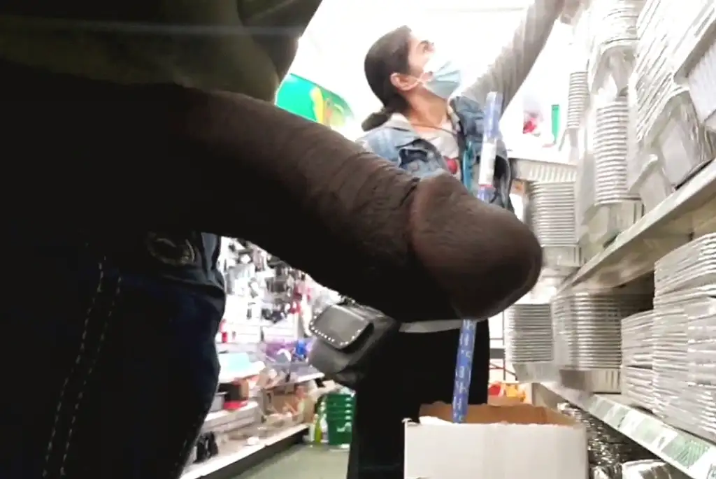 Sexy Asian MILF looking at products in the store