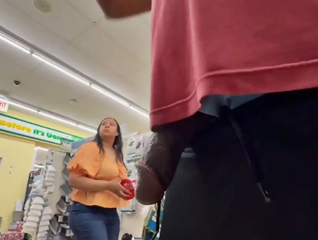 Hot brunette Latina looking at products in the store