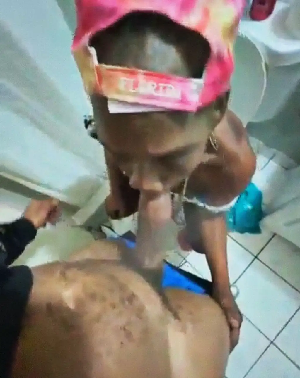 Black crackhead sucking a huge black cock in the bathroom