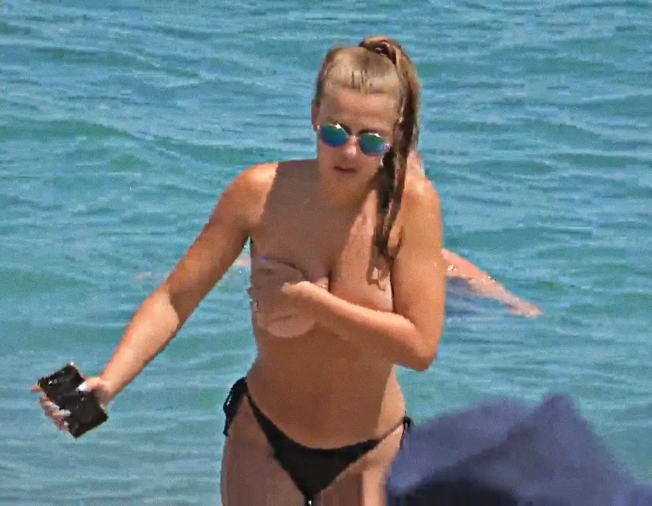 Hottie blonde going topless, holding her huge boobs