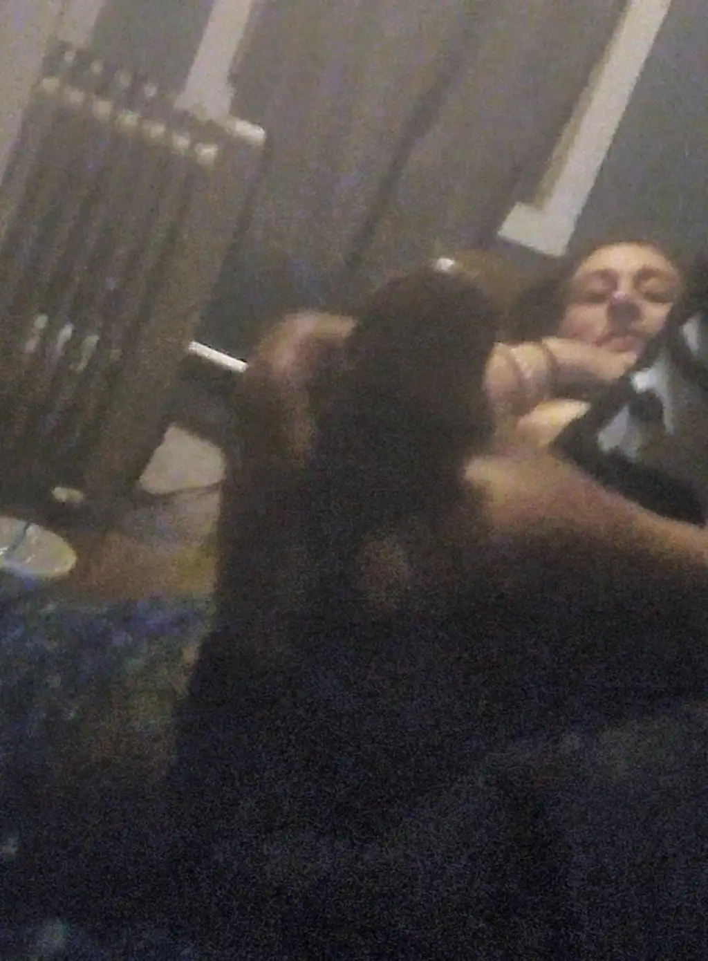 Friend with her tits out and jerking off a black cock on the couch