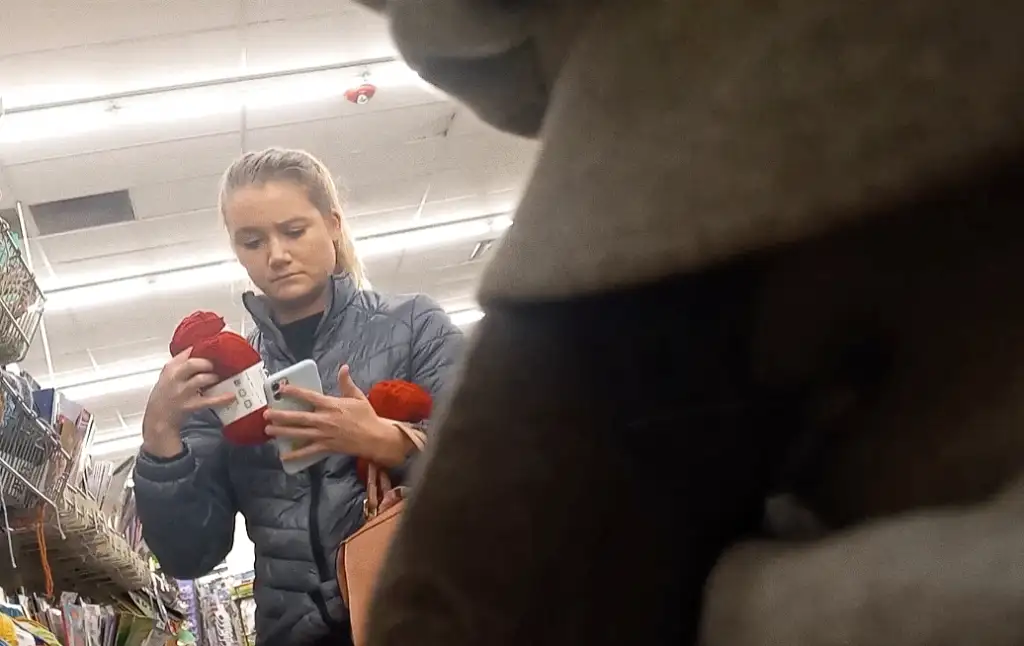 Sexy blonde MILF near black cock in store looking at products