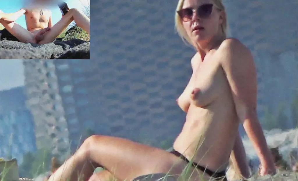 Hot blonde looking at a hard cock on a nudist beach