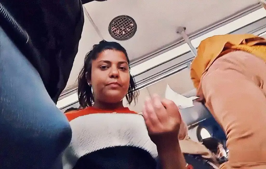 Brunette looking at bulge on the bus, she liked it