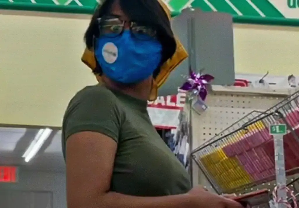 Sexy brunette with short hair reacting to a black cock in the store