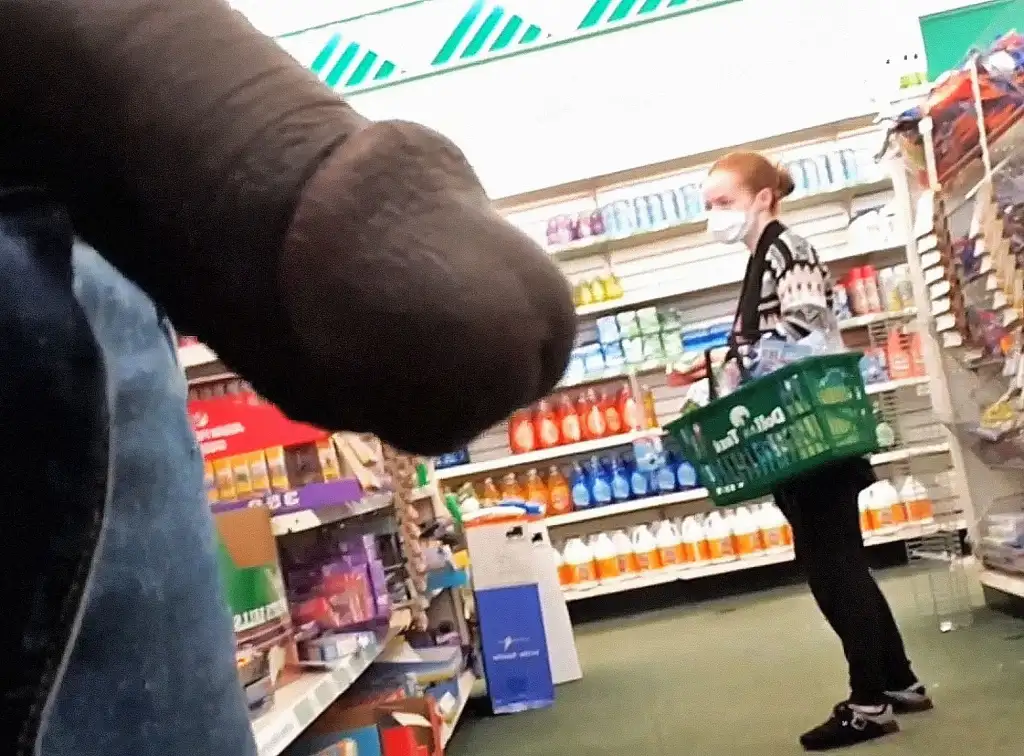 Sexy white redhead MILF in the store